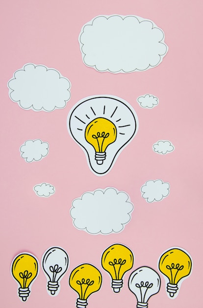 Free photo silver and golden light bulbs idea concept with clouds