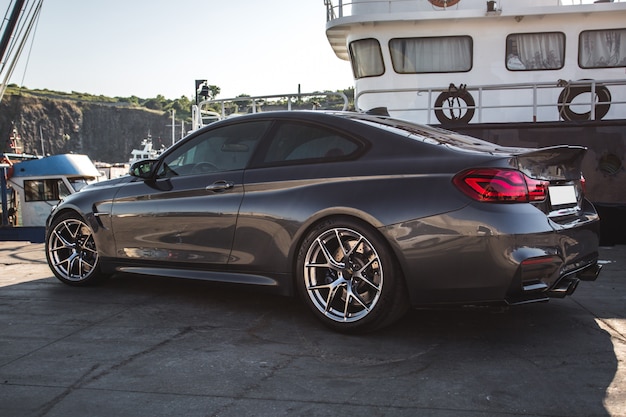 Silver luxury sport car in the port.