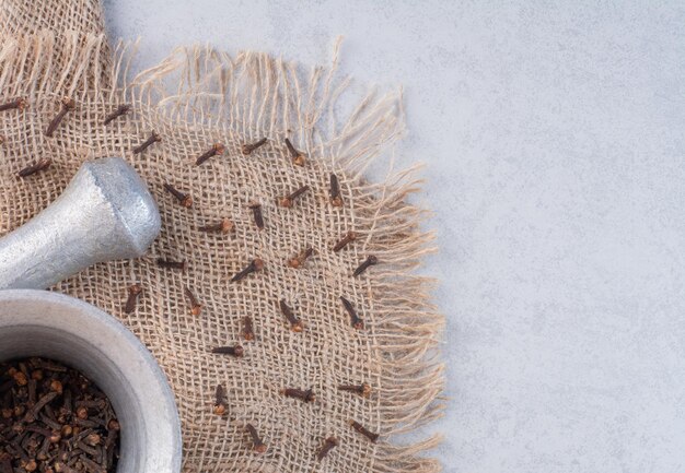 Silver mortar and pestle for blending spices and herbs.