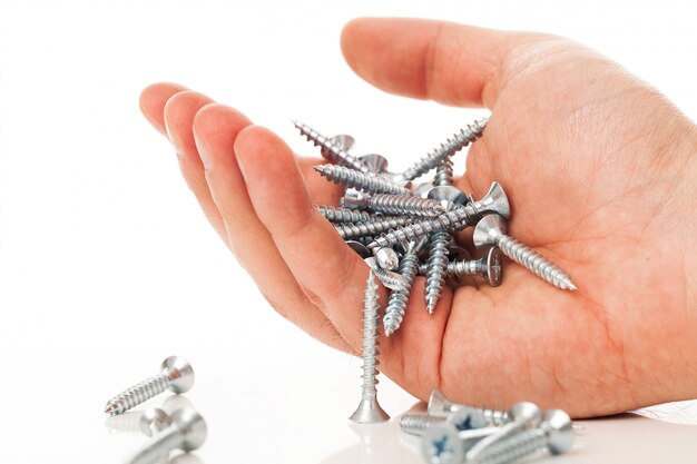 Free photo silver nails in human hand