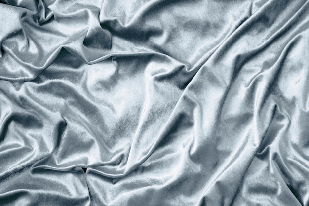 Серебряная блестящая текстура из шелковой ткани