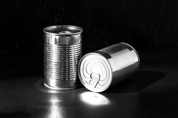 Free photo silver tall round tin cans