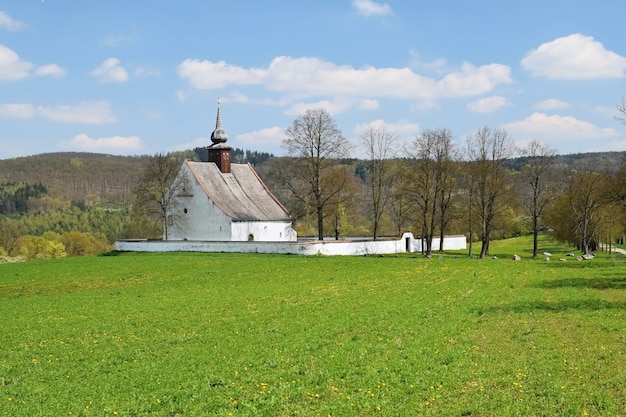 "Simple church in field"