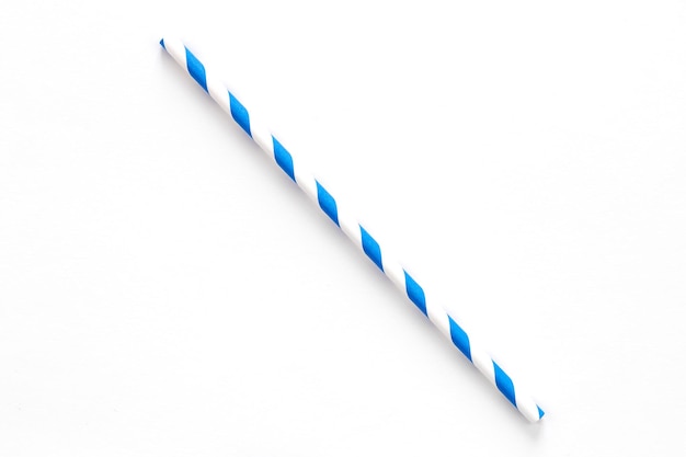 A single blue drinking straw with red and white stripes on white background