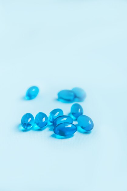 Single blue softgel capsule pill