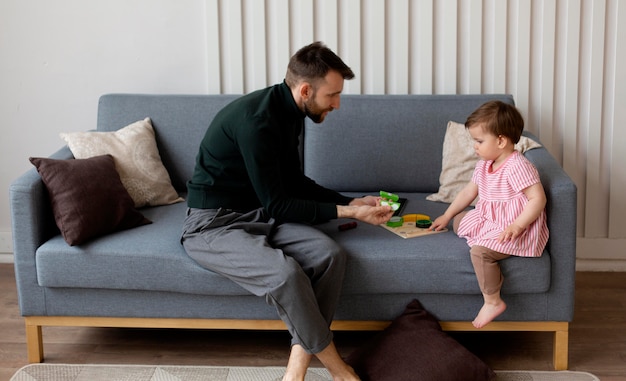 Free photo single father spending time with his baby