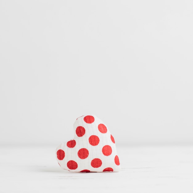 Free photo single little heart shaped stuffed toy