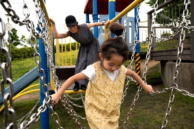 Single mom playing with her daughter in a park