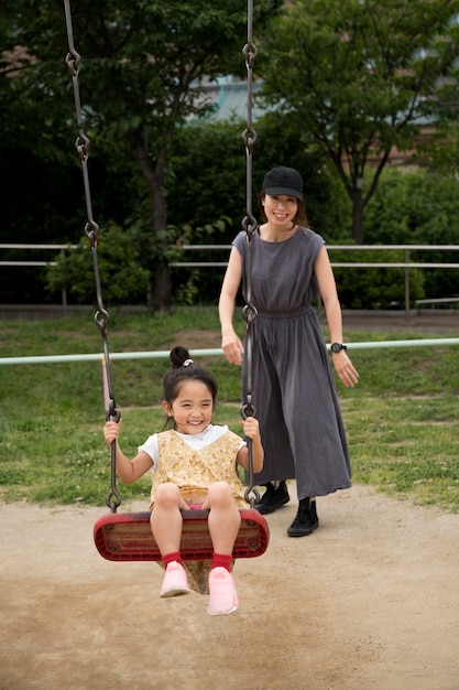 Free photo single mom playing with her daughter