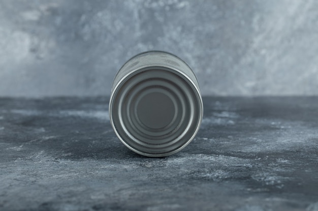 Single tin can placed on marble.