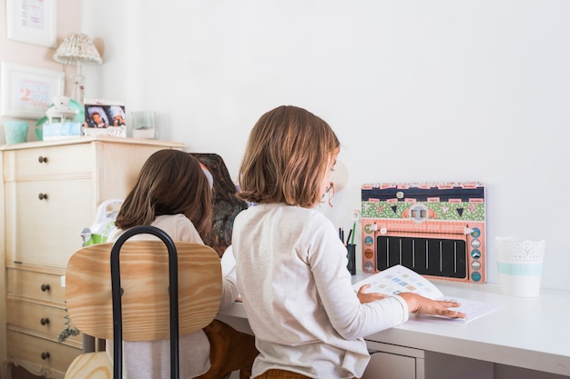 Sisters doing homework together