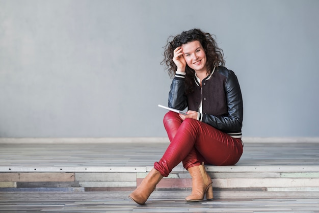 Free photo sitting friendly woman