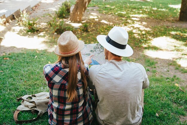 Sitting on the grass and looking at the map