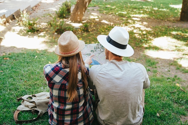 Sitting on the grass and looking at the map