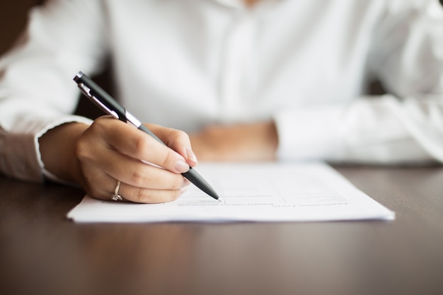 sitting human woman workplace paper