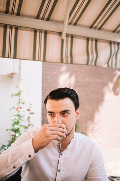 Sitting man drinking water