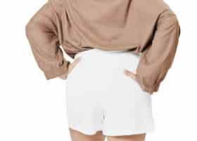 Free photo size inclusive women's fashion white shorts facing back