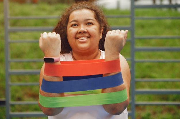 Free photo over the size of a woman doing stretching exercises