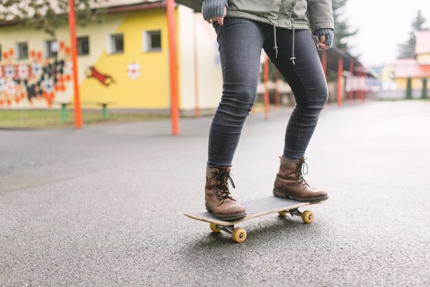 Skateboarder skateboarding on city street