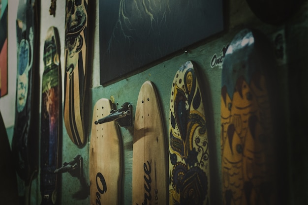 Skateboards in different colors on the wall