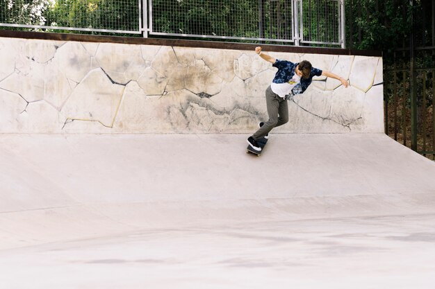 Skater boy in half pipe