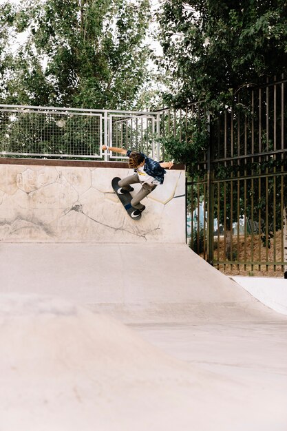 Skater boy skating in half pipe