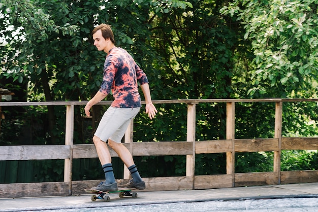 Skater on edge of ramp