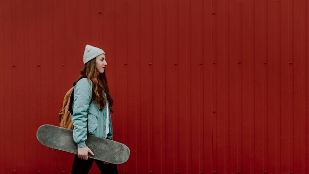 Skater girl in the urban copy space