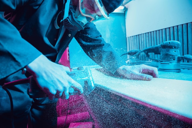 Skater in process of making his own skateboard