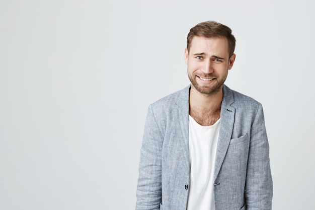 Skeptical bearded guy scoff, laughing at someone