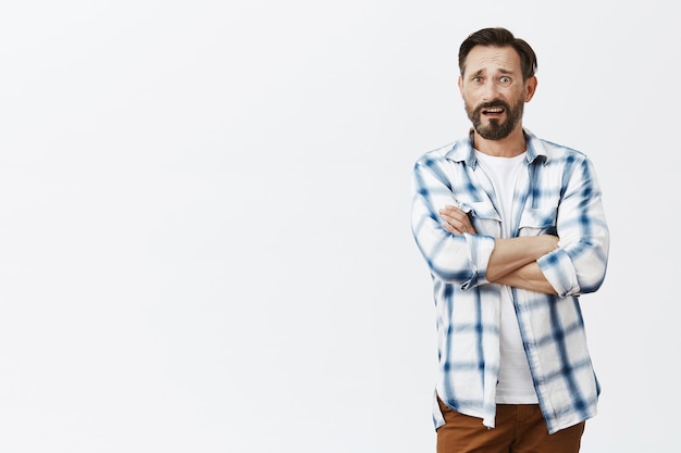 Skeptical bearded mature man posing