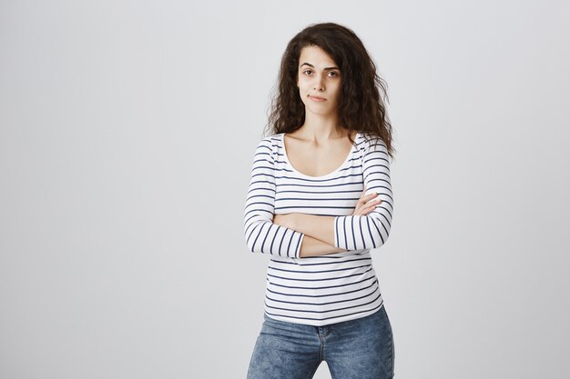 skeptical woman cross arms chest, smirk and looking unsatisfied