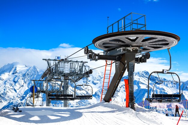 Ski lift chairs on bright winter day