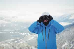 Free photo skier looking through binocular