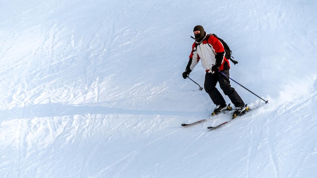 Skier riding on a ski track in the Carpathians in winter Romania