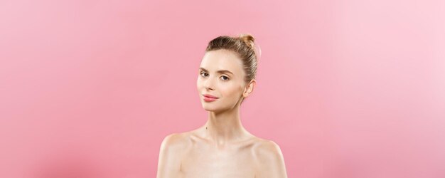 Skin Care Concept Charming young caucasian woman with perfect makeup photo composition of brunette girl Isolated on pink background with Copy Space