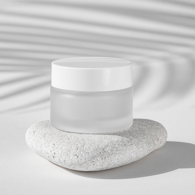 Free photo skin care moisture recipient on a white rock