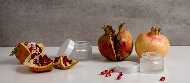 Skin care product arrangement with pomegranates