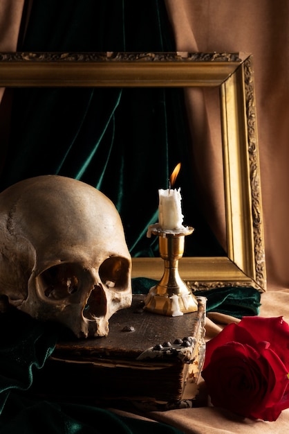 Free photo skull and candle arrangement still life