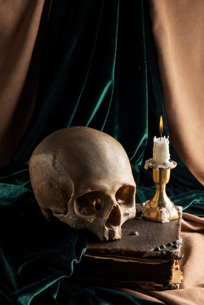 Free photo skull and candle arrangement still life