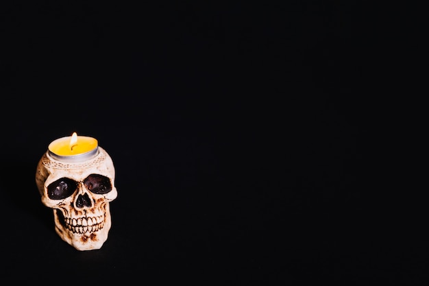 Skull candle with flame