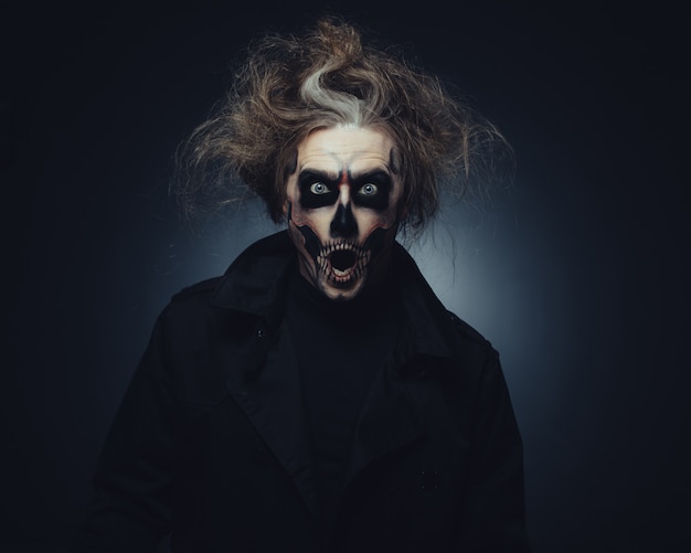 Skull makeup portrait of young man