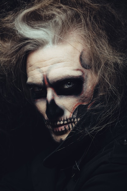 Skull makeup portrait of young man