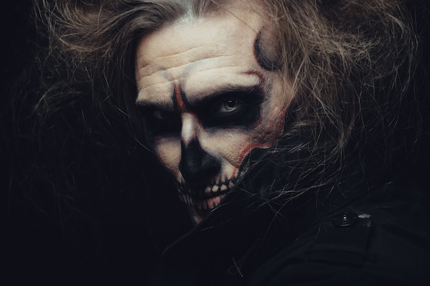 Skull makeup portrait of young man