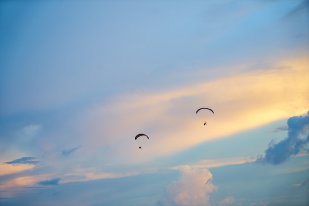 Sky with two people in parachute