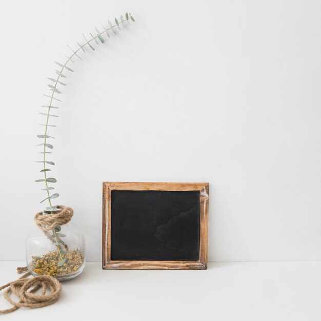 slate next to floral decoration