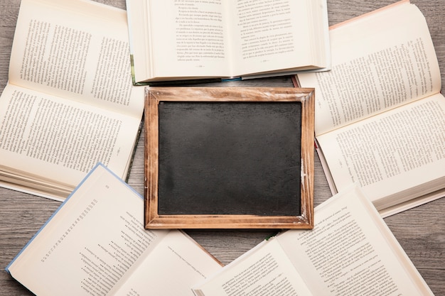 Free photo slate in middle of books