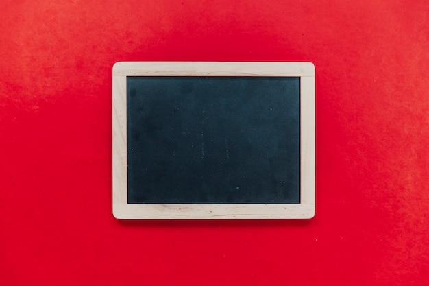 Free photo slate on red background