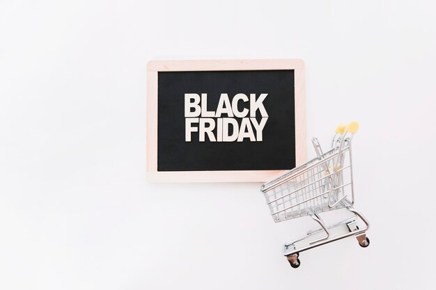 Slate with black friday letters and cart