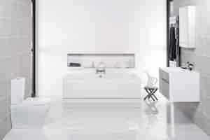 Free photo sleek minimalistic bathroom with white toilet, bathtub and sink